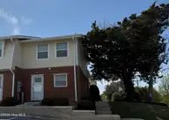 283 Salter Path Road 115, Pine Knoll Shores, NC 28512 — 2-bedroom waterfront condo in Pine Knoll Townes, Pine Knoll Shores, NC, photo 1 of 15: Front View