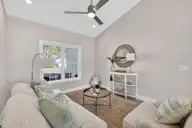 9579 Lily Pond Court NE, Leland, NC 28451 — 3-bedroom home in Lily Pond, Leland, NC, photo 7 of 33: Living room with vaulted ceiling