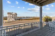 418 New River Inlet Road, North Topsail Beach, NC 28460 — 7-bedroom waterfront home in Royal Dunes, North Topsail Beach, NC, photo 7 of 62: Front Porch View
