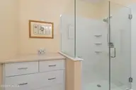 221 Woodlands Way Unit 21, Calabash, NC 28467 — 2-bedroom condo in Crow Creek, Calabash, NC, photo 17 of 39: Added Stroage and Vanity in Primary
