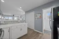 3802 Island Drive, North Topsail Beach, NC 28460 — 3-bedroom waterfront townhome in MFBostic, North Topsail Beach, NC, photo 23 of 49: Kitchen & 1/2 Bath