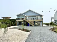 323 Caswell Beach Road, Oak Island, NC 28465 — 5-bedroom waterfront home in Caswell Beach, Oak Island, NC, photo 1 of 54: 323 Caswell Beach