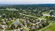 2006 Kenilworth Lane, Wilmington, NC 28405 — 3-bedroom waterfront home in Landfall, Wilmington, NC, photo 1 of 68: 062_dji_20260508162131_0652_d_233
