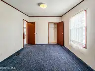 107 Bluebird Drive, Elizabeth City, NC 27909 — 3-bedroom manufactured home in Halls Creek Village, Elizabeth City, NC, photo 16 of 21: Bedroom 2
