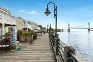 1005 Queen Street, Wilmington, NC 28401 — 3-bedroom waterfront home in Downtown, Wilmington, NC, photo 9 of 52: 46-FinalExterior-BoardwalkDowntown-9