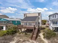 3909 W Beach Drive, Oak Island, NC 28465 — 4-bedroom waterfront home, Oak Island, NC, photo 11 of 52: 12-web-or-mls-DJI_20260408140419_0419_D