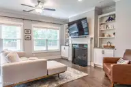 357 Wheatfield Way, Whispering Pines, NC 28327 — 5-bedroom home in Summerfield at Arrowstone, Whispering Pines, NC, photo 17 of 44: Living Room with Gas Fireplace