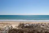 1509 Ocean Drive West, Emerald Isle, NC 28594 — 4-bedroom waterfront townhome in Emerald Isle By The Sea, Emerald Isle, NC, photo 22 of 26: 2 Seas the Day West 031 king balcony