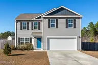 67 Fresh Air Drive, Hampstead, NC 28443 — 3-bedroom home in Hope Creek, Hampstead, NC, photo 1 of 45: 67 Fresh Air Hampstead Front