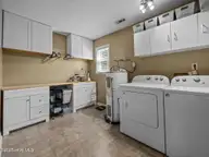 344 Riggs Road, Hubert, NC 28539 — 3-bedroom home in Ole Mill Village, Hubert, NC, photo 18 of 31: Laundry Room