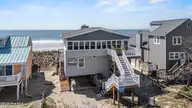 5127 W Beach Drive, Oak Island, NC 28465 — 5-bedroom waterfront home, Oak Island, NC, photo 5 of 73: 70_drone