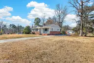 209 Cardinal Road, Jacksonville, NC 28546 — 3-bedroom home in Cardinal Village, Jacksonville, NC, photo 3 of 26: Side of House