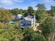 1316 Heron Run Drive, Wilmington, NC 28403 — 3-bedroom waterfront home in Heron Run, Wilmington, NC, photo 24 of 29: 54_back right exterior