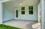 3048 Coastal Dream Way, Leland, NC 28451 — 4-bedroom townhome in Grand Park, Leland, NC, photo 19 of 39: Covered Porch