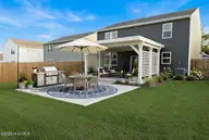 212 Ocean Pointe Boulevard SE 5201, Bolivia, NC 28422 — 4-bedroom home in Ocean Pointe, Bolivia, NC, photo 5 of 17: backyard-AI