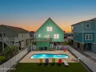 1414 E Beach Drive, Oak Island, NC 28465 — 3-bedroom waterfront home, Oak Island, NC, photo 1 of 55: 1-web-or-mls-CAMMediaLLC.com (55 of 55)