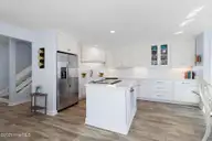 301 Salter Path Road 12 Genesis, Pine Knoll Shores, NC 28512 — 3-bedroom waterfront condo in Genesis, Pine Knoll Shores, NC, photo 16 of 48: Kitchen with Island