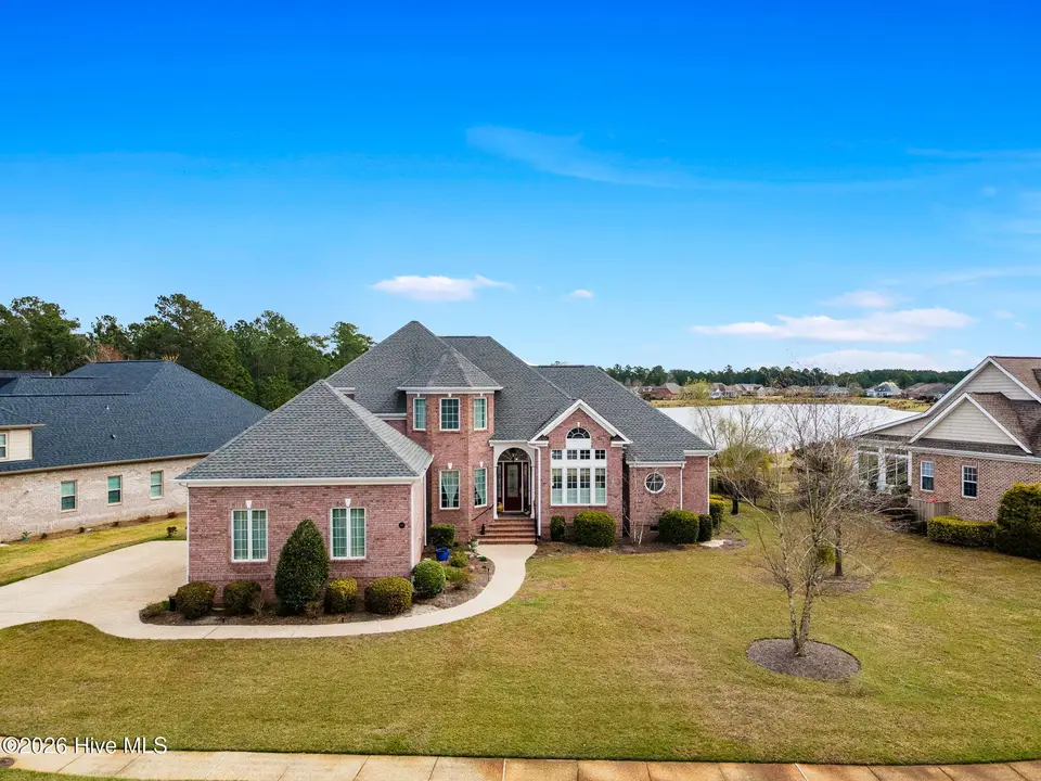 2212 Talmage Drive, Leland, NC 28451 — 3-bedroom waterfront home in Brunswick Forest, Leland, NC, photo 1 of 61: 1-web-or-mls-GI - 2212 Talmage Dr - List