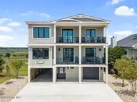 6620 Kings Lynn Drive, Oak Island, NC 28465 — 7-bedroom waterfront home in Kings Lynn, Oak Island, NC, photo 1 of 79