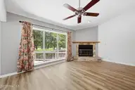 7601 Windward Drive, New Bern, NC 28560 — 3-bedroom waterfront condo in Fairfield Harbour, New Bern, NC, photo 5 of 52: Living Area with Fireplace