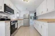728 Warrior Trail, Whiteville, NC 28472 — 2-bedroom home, Whiteville, NC, photo 12 of 38: Kitchen w/ Door to Porch Open!