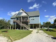 7218 Canal Drive, Emerald Isle, NC 28594 — 4-bedroom waterfront home in Archers Point, Emerald Isle, NC, photo 1 of 40: 7218 CANAL DRIVE