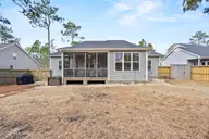 1268 S Shore Drive, Southport, NC 28461 — 3-bedroom home in South Shore Landing, Southport, NC, photo 14 of 49: Back Exterior