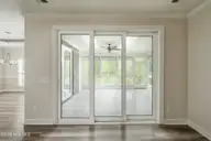 8983 Mango Bay Court NE, Leland, NC 28451 — 4-bedroom townhome in Compass Pointe, Leland, NC, photo 19 of 53: Telescopic Doors