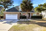 717 Settlers Lane, Kure Beach, NC 28449 — 4-bedroom waterfront home in Kure Beach Village, Kure Beach, NC, photo 1 of 69: 2_717_Settlers_Ln_-_Exteriors_010