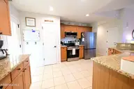 103 Spanish Moss Court, Hampstead, NC 28443 — 3-bedroom home in Forest At Belvedere, Hampstead, NC, photo 13 of 28: Large kitchen