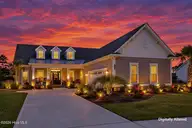 9170 Crossbill Drive, Leland, NC 28451 — 3-bedroom waterfront home in Brunswick Forest, Leland, NC, photo 1 of 72: 9170CrossbillDrive-1_Dusk