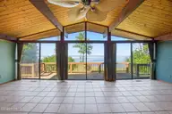 1 Nicklaus Drive, New Bern, NC 28560 — 3-bedroom waterfront home in Carolina Pines, New Bern, NC, photo 7 of 68: Wall to Ceiling Views