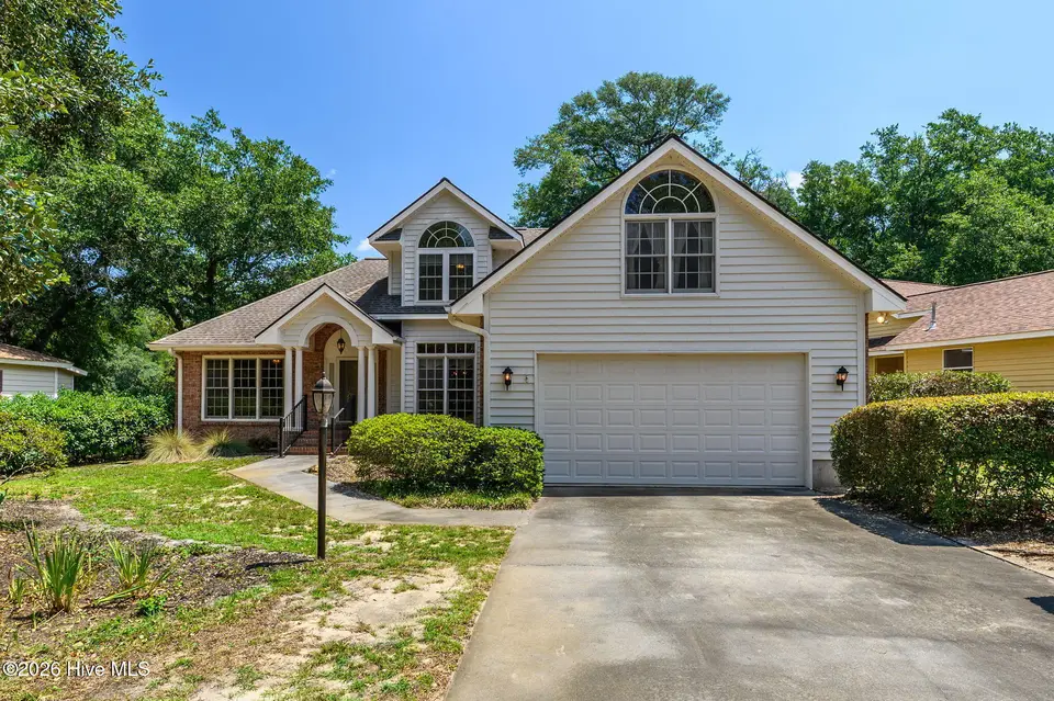 514 Woods Court SW, Sunset Beach, NC 28468 — 3-bedroom home in Sea Trail Plantation, Sunset Beach, NC, photo 1 of 50: 23-web-or-mls-16 front