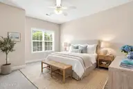 613 Elfin Court, Leland, NC 28479 — 2-bedroom townhome in Westport, Leland, NC, photo 14 of 28: Primary Bedroom Virtually Staged