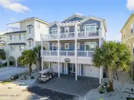 7 Coggeshall Drive W, Ocean Isle Beach, NC 28469 — 6-bedroom waterfront home in West Ocean Palms, Ocean Isle Beach, NC, photo 2 of 77: 7 Coggleshall