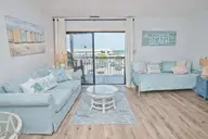 9100 Reed Drive 3202, Emerald Isle, NC 28594 — 1-bedroom waterfront condo in Queens Court, Emerald Isle, NC, photo 5 of 52: Virtually staged