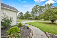 1112 Sunburst Way, Leland, NC 28451 — 3-bedroom home in Lanvale Trace, Leland, NC, photo 5 of 47: 5_frontyard