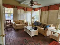 528 Ole Farm Trail, Whiteville, NC 28472 — 4-bedroom home in Runnymeade, Whiteville, NC, photo 9 of 32: Sun Room 2