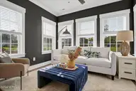 591 Heart Pine Avenue, Wilmington, NC 28411 — 4-bedroom home in Indigo at Abbey Preserve, Wilmington, NC, photo 14 of 31: Sunroom - Nantanaha - Cottages at Bradle