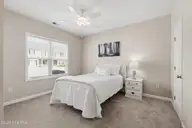 155 Lincoln Place Circle, Leland, NC 28451 — 3-bedroom townhome in Lincoln Place Townhomes, Leland, NC, photo 18 of 39: Downstairs Bedroom