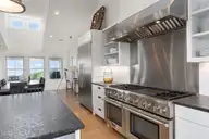 585 Forest Dunes Drive, Pine Knoll Shores, NC 28512 — 4-bedroom waterfront home in Beacon's Reach, Pine Knoll Shores, NC, photo 16 of 68: Gourmet kitchen w/ oversized pantry