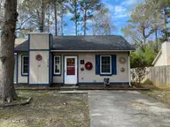 234 Cedar Creek Drive, Jacksonville, NC 28540 — 2-bedroom townhome in Cedar Creek, Jacksonville, NC, photo 1 of 15: 1 front 234 Cedar Creek Dr Jacksonville