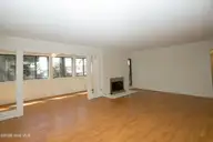 250 Sugar Gum Lane 124, Pinehurst, NC 28374 — 3-bedroom condo in Lakeview Condos, Pinehurst, NC, photo 10 of 55: Sunroom & Fireplace