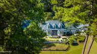 667 Yadkin Road, Southern Pines, NC 28387 — 5-bedroom home in Horse Country, Southern Pines, NC, photo 2 of 26: houseexterioraerial