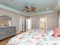 129 Sunset Drive, Cedar Point, NC 28584 — 3-bedroom waterfront home in Plantation Shores, Cedar Point, NC, photo 14 of 46: 015-1280x960-master-bedroomPrimary