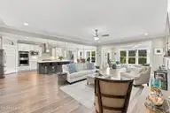 1068 Snowden Road, Wilmington, NC 28412 — 3-bedroom home in Riverlights - Del Webb, Wilmington, NC, photo 18 of 74: 18_hallway, kitchen & living area