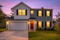 1439 Judith Drive SE, Bolivia, NC 28422 — 3-bedroom home in New South Bridge, Bolivia, NC, photo 2 of 54: Twilight glow on suburban home