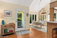 579 Coral Ridge Road, Pine Knoll Shores, NC 28512 — 4-bedroom waterfront home in Beacon's Reach, Pine Knoll Shores, NC, photo 7 of 62: Entryway & Dining Area