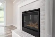 8983 Mango Bay Court NE, Leland, NC 28451 — 4-bedroom townhome in Compass Pointe, Leland, NC, photo 10 of 53: Gas Fireplace