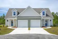 225 Sandpiper Place, Holly Ridge, NC 28445 — 3-bedroom townhome in Coastal Village, Holly Ridge, NC, photo 2 of 30: 225.227 Sandpiper Place - Exterior - MLS